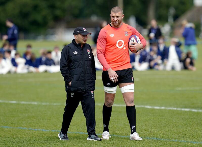 England head coach Eddie Jones speaks to Nick Isiekwe. PA