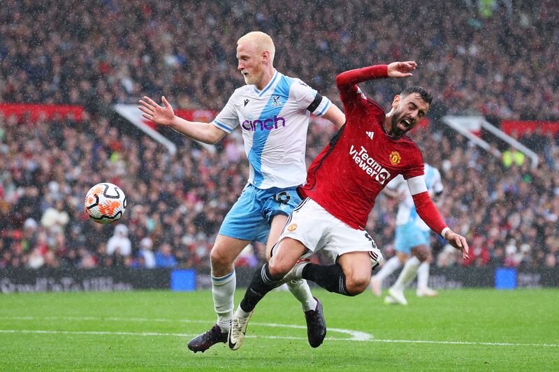 Will Hughes of Crystal Palace challenges for the ball with Bruno Fernandes of Manchester United during their match at Old Trafford on Saturday, September 30, 2023. Getty