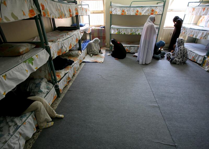 Iranian women prisoners sit inside their cell in Tehran's Evin prison June 13, 2006. Iranian police detained 70 people at a demonstration in favour of women's rights, the judiciary said on Tuesday, adding it was ready to review reports that the police had beaten some demonstrators.  REUTERS/Morteza Nikoubazl (IRAN)