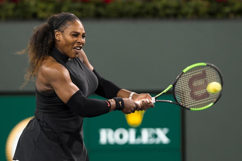 Serena Williams, of the United States, hits a backhand to Zarina Diyas, of Kazakhstan, during the first round of the BNP Paribas Open tennis tournament in Indian Wells, Calif., Thursday, March 8, 2018. (AP Photo/Crystal Chatham)