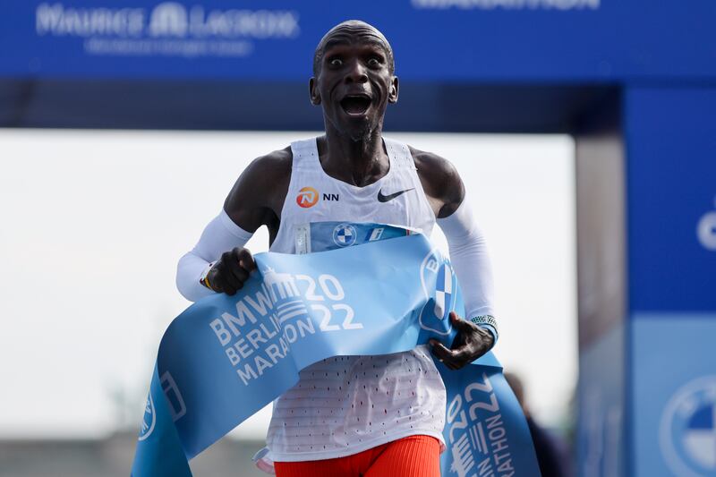 Kenya's Eliud Kipchoge crosses the line to win the Berlin Marathon in Berlin, Germany, Sunday, Sept.  25, 2022.  Olympic champion Eliud Kipchoge has bettered his own world record in the Berlin Marathon.  Kipchoge clocked 2:01:09 on Sunday to shave 30 seconds off his previous best-mark of 2:01:39 from the same course in 2018.  (AP Photo / Christoph Soeder)