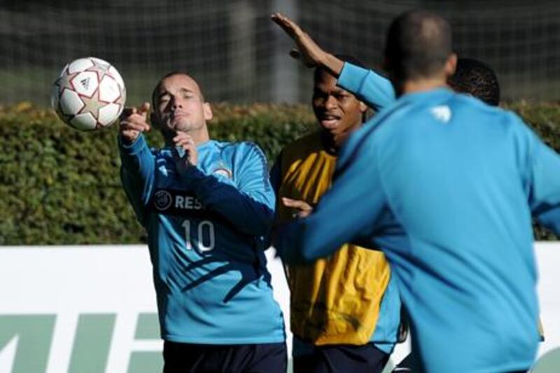Inter’s Dutch midfielder Wesley Sneijder, left, jokes around in training yesterday.