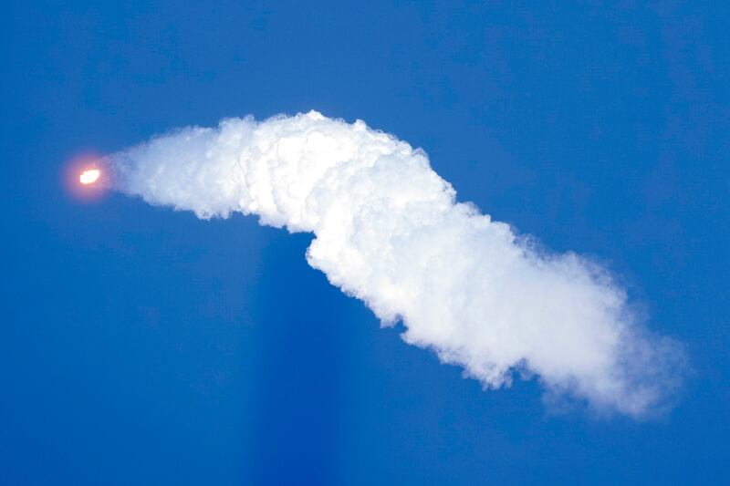 The rocket leaves a trail of smoke behind. AP Photo