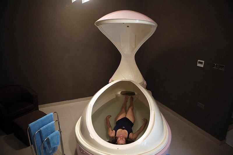 Penny Brewer, the director of Point Zero Floatation Center, demonstrates flotation therapy. Sammy Dallal / The National