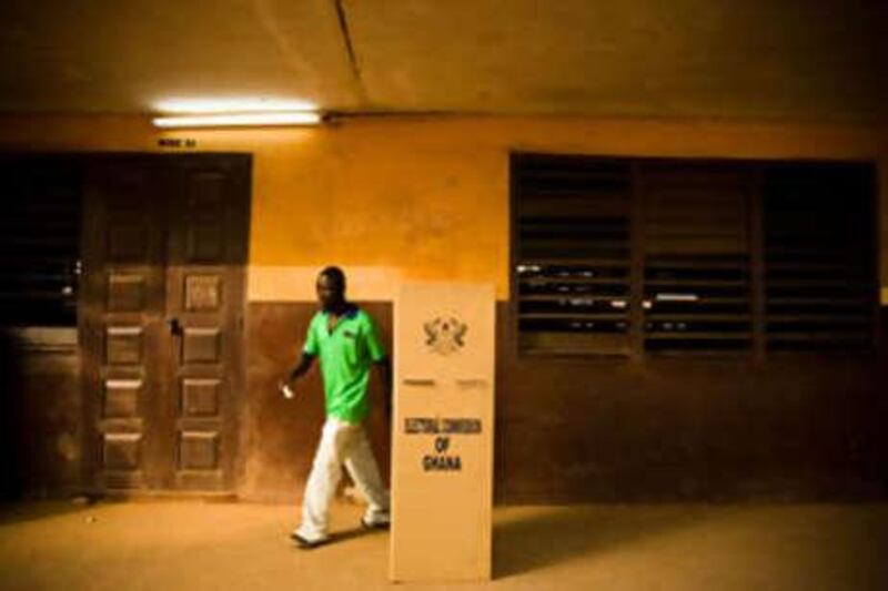 A man leaves a voting booth after filling his ballot during presidential elections in Accra, Ghana.