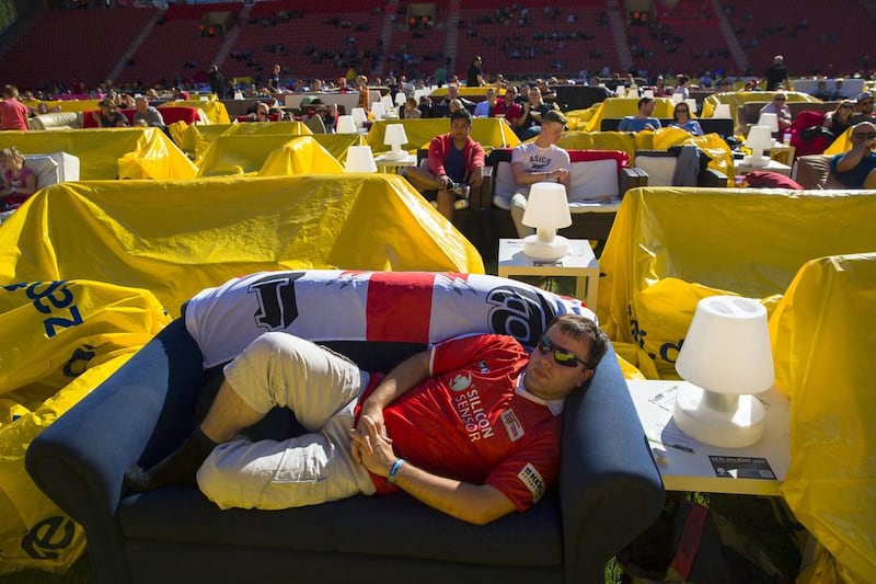 People sit on sofas as they watch a 2014 World Cup match at the Alte Forsterei stadium in Berlin on June 15, 2014. Thomas Peter / Reuters