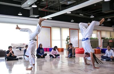 December 9, 2017. Academic City, Dubai.  Capoeira/sustainability workshop for children and Knowledge and Human Development Authority staff.  (L-R) Marwan and Fernando demostrating some Capoeira moves.
Victor Besa for The National
National
Reporter:  Haneen Dajan