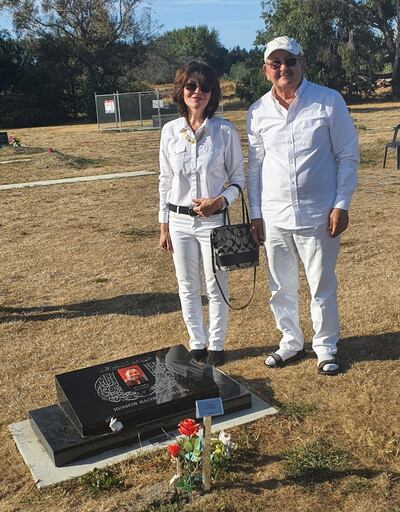Janna Ezat and Hazim Al-Umari at her son Hussein Al-Umari's grave. Courtesy Janna Ezat