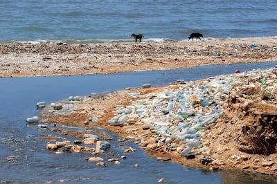 Sewage outlet and empty plastic bottles are photographed near the public beach in Khaldeh, near Beirut, Lebanon June 6, 2017. REUTERS/Mohamed Azakir - RC18220FF800