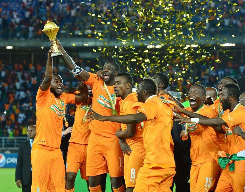 Yaya Toure holds aloft the Africa Cup of Nations trophy after Ivory Coast's win in the final against Ghana on Sunday. Gavin Barker / EPA