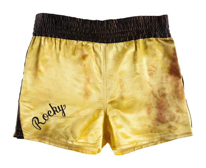 The boxing trunks worn by Sylvester Stallone in the 1982 movie 'Rocky III' are among the more than 1,400 costumes, props and personal items to be sold in October by Heritage Auctions in Los Angeles. Heritage Auctions via AP