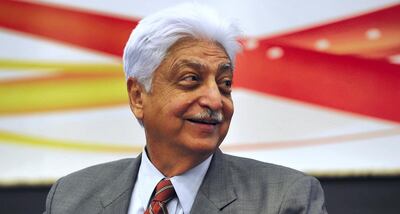 Indian Chairman of Wipro Limited, Azim Premji, smiles during a press conference held to announce the company's 2nd quarter results in Bangalore on November 2, 2012. India's third-largest outsourcing firm Wipro reported second-quarter net profit jumped 24 percent, thanks to stronger demand as customers sought to reduce costs in a weak global economy. AFP PHOTO/ Manjunath KIRAN (Photo by Manjunath Kiran / AFP)