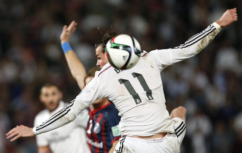 Real Madrid’s Gareth Bale heads ball during the final match against San Lorenzo  for the Club World Cup soccer tournament, in Marrakech, Morocco, Saturday, Dec. 20, 2014. (AP Photo/Abdeljalil Bounhar)