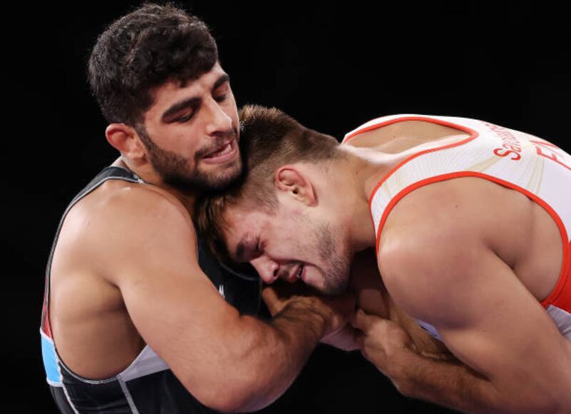 Mohammadhadi Saravi (L) of Iran landed bronze in Greco-Roman wrestling.