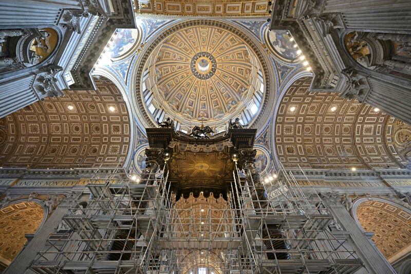 Scaffolding is mounted around the baldachin of St. Peter's basilica to start its restoration in the Vatican. AFP