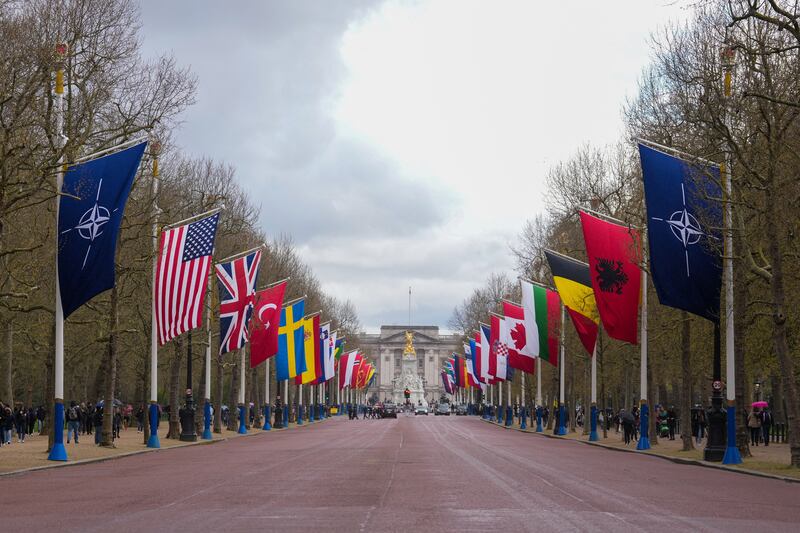Flags of Nato and its member states are displayed along The Mall in London. Reuters