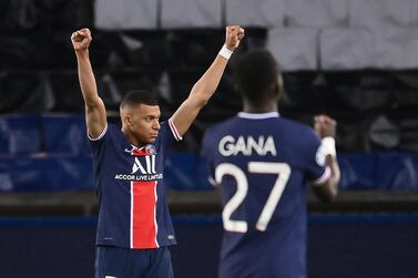 Paris Saint-Germain forward Kylian Mbappe celebrates with midfielder Idrissa Gueye after winning the Champions League quarter-final against Bayern Munich. AFP