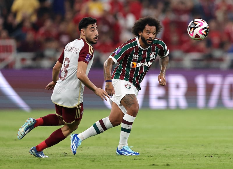 Fluminense's Marcelo in action with Al Ahly's Akram Tawfik. Reuters