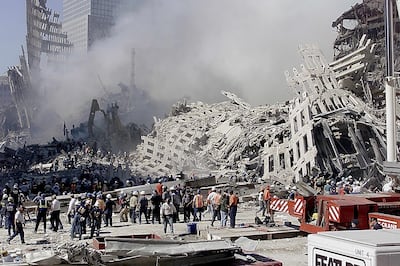 Fire and rescue workers search through the rubble of the World Trade Center in New York, in September 2001. EPA