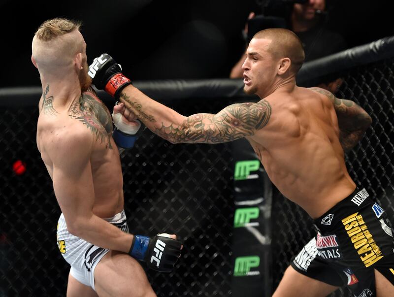 LAS VEGAS, NV - SEPTEMBER 27:  (R-L) Dustin Poirier punches Conor McGregor in their featherweight bout during the UFC 178 event on September 27, 2014 in Las Vegas, Nevada. (Photo by Jeff Bottari/Zuffa LLC/Zuffa LLC via Getty Images) 