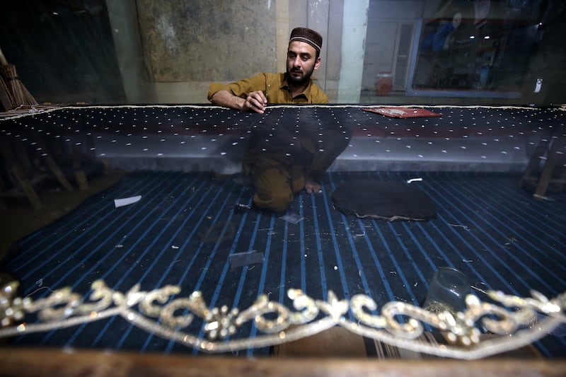 An embroiderer in Pakistan's northern city of Peshawar. EPA