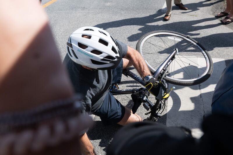 The president was wearing a helmet but no knee pads. AFP