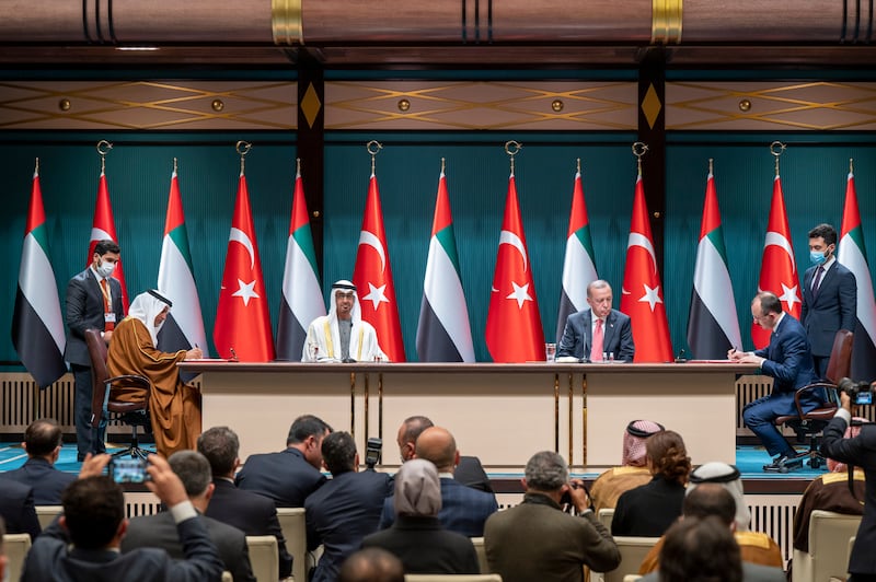 Sheikh Mohamed and Mr Erdogan witness the signing of an agreement between Mr Al Shamsi and Mehmet Mus, Turkish Minister of Trade. Abdulla Al Neyadi / Ministry of Presidential Affairs