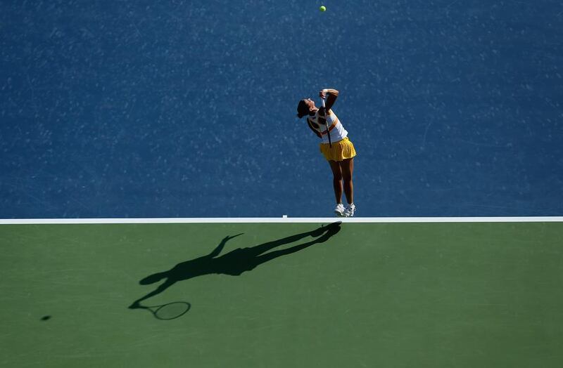 Flavia Pennetta of Italy in action against Venus Williams of the USA during Day 4 of the Dubai Duty Free Tennis Championships on February 20, 2014. Warren Little / Getty Images