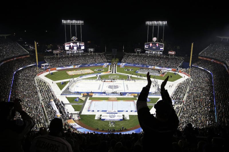 Fans cheer before NHL outdoor hockey game at Dodger Stadium in Los Angeles on Saturday. Jae C Hong / AP Photo

