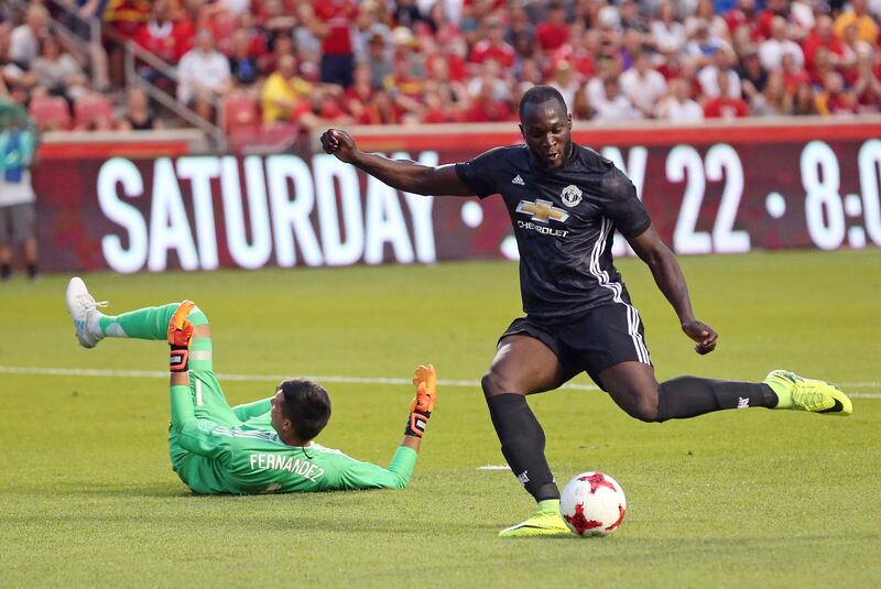 Manchester United forward Romelu Lukaku, right, scores against Real Salt Lake goalkeeper Lalo Fernandez. Rick Bowmer / AP Photo