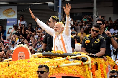 Indian Prime Minister Narendra Modi waves to the crowd while campaigning for his Bharatiya Janata Party ahead of the state elections in Karnataka. AP Photo