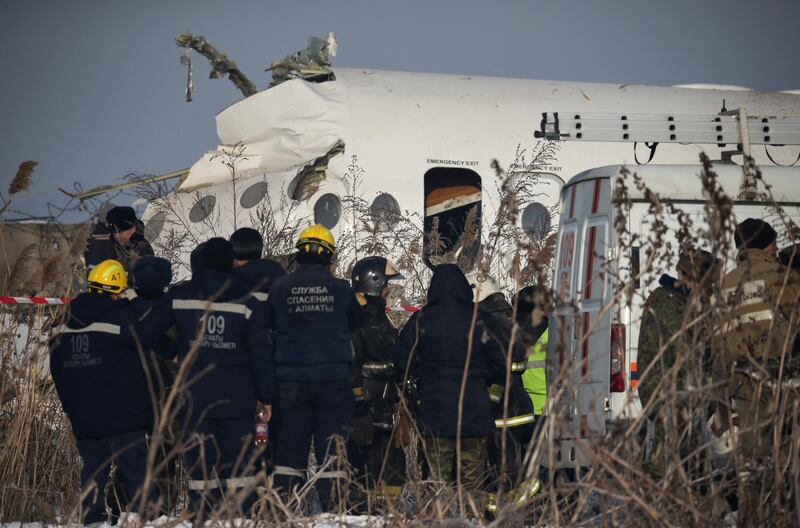 Emergency and security personnel are seen at the site of a plane crash near Almaty, Kazakhstan.  Reuters