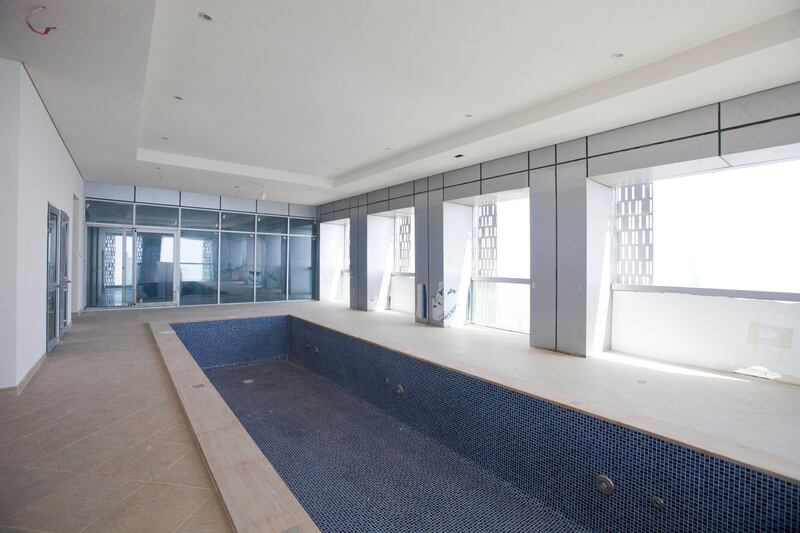 Dubai, United Arab Emirates - June 11 2013 - The swimming pool of the 72nd floor penthouse apartment at the Cayan Tower in the Dubai Marina.  (Razan Alzayani / The National)