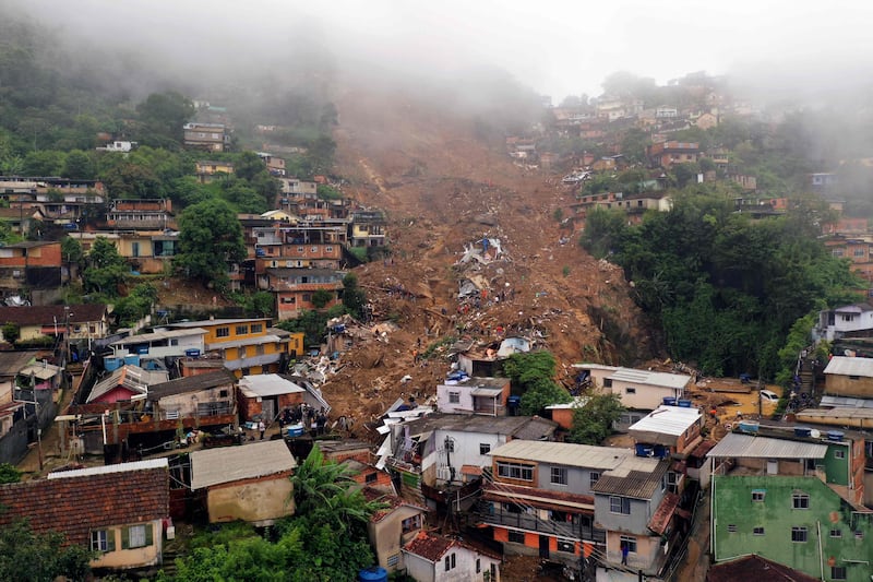 A mudslide that swept away homes and buried people after heavy rains in Petropolis, north of Rio de Janeiro, Brazil. At least 94 people were killed. AFP