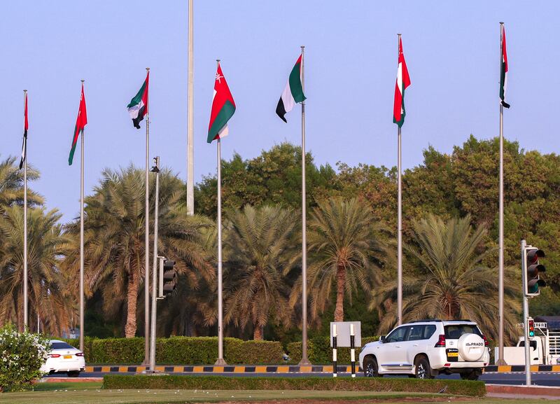 The UAE and Oman flags side by side in Muscat. Victor Besa /The National