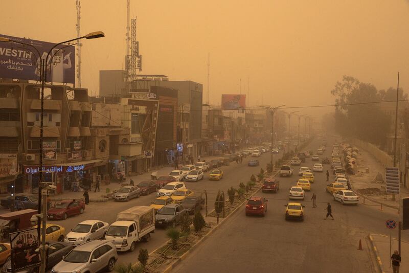A sandstorm clouds the main road in Iraq's northern city of Mosul. All photos: AFP