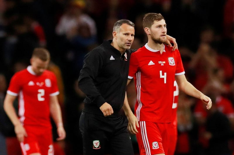 Ryan Giggs and Ben Davies after the match between Wales vs Spain. Reuters