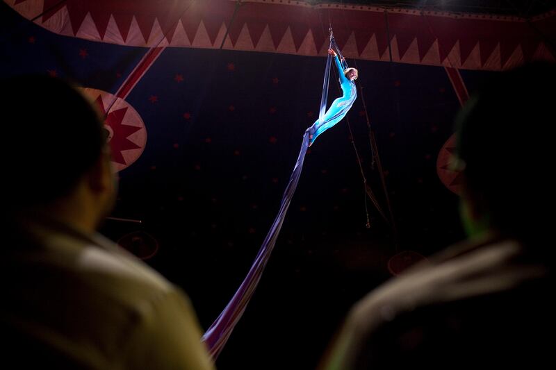 Abu Dhabi, United Arab Emirates, April 28, 2013: 
Ukrainian rope artist Jevgenia Shchokina enjoys her moment flying high near the circus tent roof, as she performs on Sunday, April 28, 2013, at the at the Monte Carlo circus in Mussafah, an industrial subsection of Abu Dhabi. 
Silvia Razgova / The National
