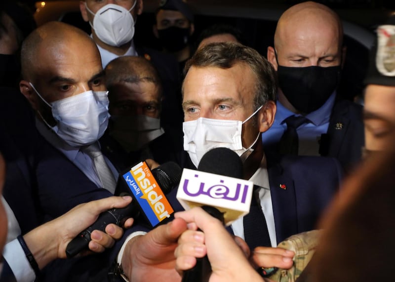 French President Emmanuel Macron talks to journalists as he leaves the home of Fairouz, one of the Arab world's most famed singers, after visiting her in Rabieh, Lebanon. Reuters