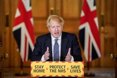 Boris Johnson unveiled a coronavirus alert system for the UK that was based on the spread of the disease. AFP
