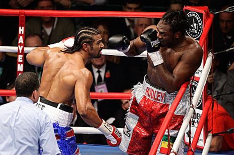The exciting David Haye, left, took just over eight minutes to dispose of a rather boring Audley Harrison in their WBA Heavyweight championship contest in Manchester on Saturday night.
