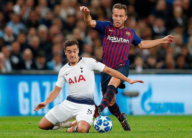 Tottenham Hotspur's Harry Winks is challenged by Barcelona's Arthur. AFP