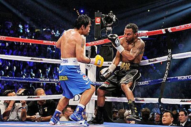 Manny Pacquiao, left, dominated Shane Mosley from start to finish.