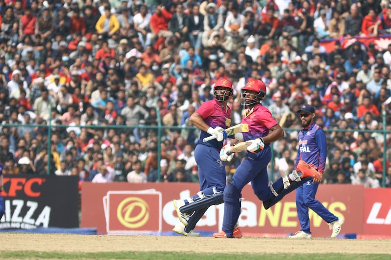 UAE captain Muhammad Waseem, left, and Vriitya Aravind run between the wickets