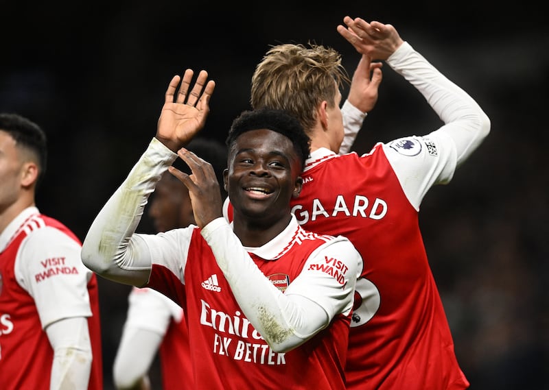 Arsenal's Martin Odegaard celebrates scoring their second goal with Bukayo Saka in the 2-0 Premier League win against Spurs at Tottenham Hotspur Stadium on January 15, 2023. Reuters