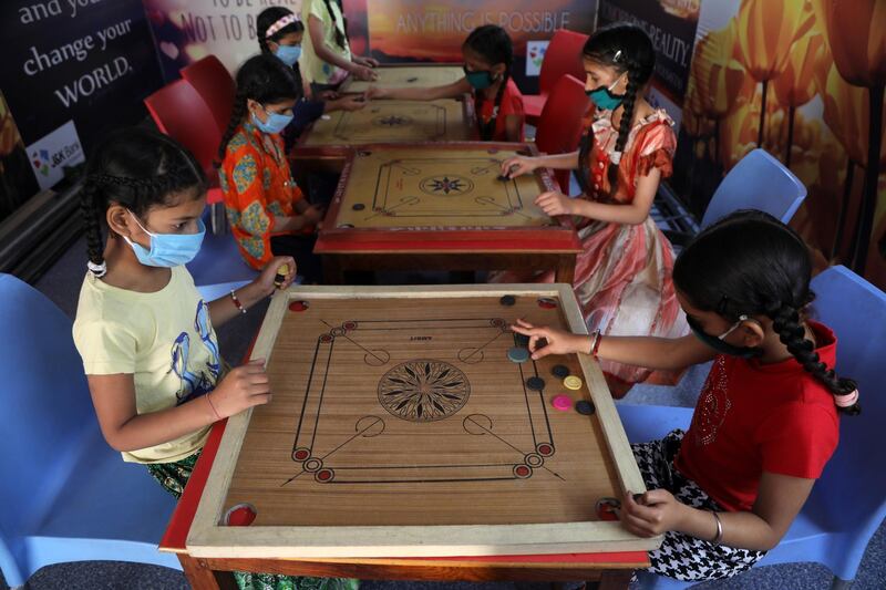 Carom games on at Balgran Charitable Orphanage home during the lockdown, Jammu, India in April. Jaipal Singh/ EPA