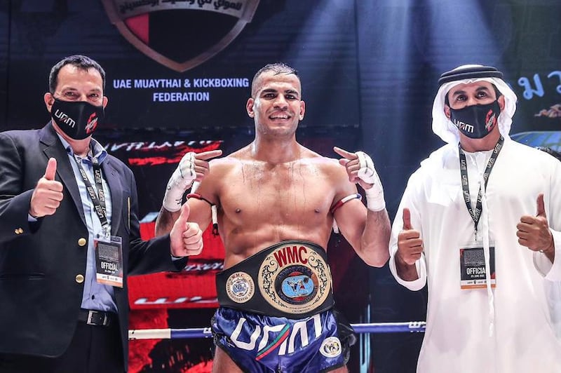 Ilyas Habibali is flanked by Stephen Fox, vice president of the World Muaythai Council, and Abdullah Al Neyadi, president of the UAE Muaythai and Kickboxing Federation. Courtesy UAM