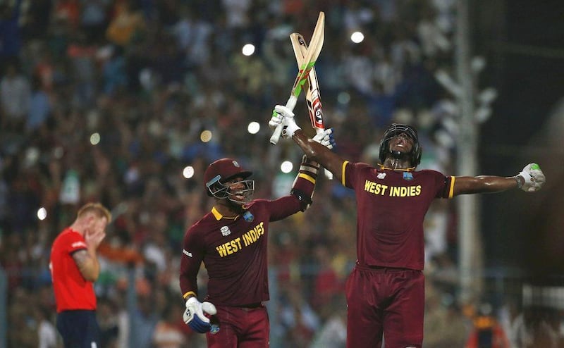 West Indies Carlos Brathwaite, right, and Marlon Samuels celebrate after winning the final. REUTERS/Adnan Abidi