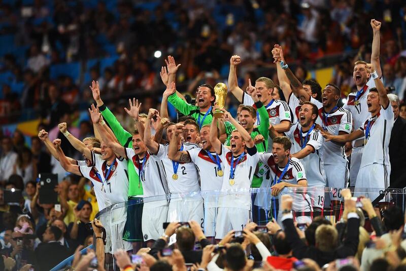 Philipp Lahm of Germany lifts the World Cup – the country's fourth and first since reunification. Matthias Hangst / Getty Images