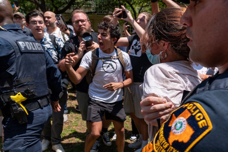 A protester confronts University of Texas police. AFP